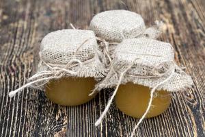 fresh bee honey packed in glass jars photo