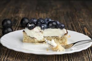 tartlet with chocolate and buttercream with blueberries photo