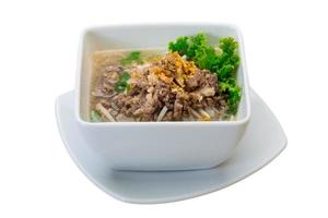 Thai soup with minced meat on white background photo