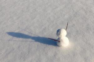 snowmen made of snow in winter photo