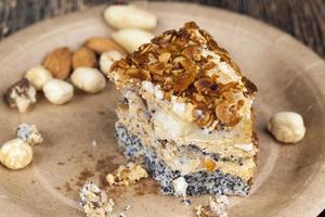 sweet cake with buttercream and sponge cake and lots of poppy seeds and nuts photo
