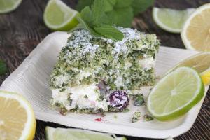 green cake with cream and lime photo