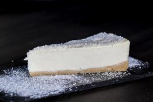 dessert cheesecake covered with dried coconut pulp photo