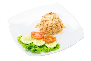 Fried rice with shrimps on the plate and white background photo