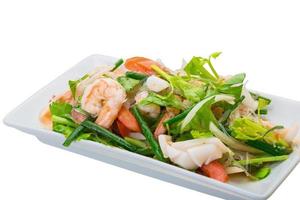 Glass noodle with seafood on the plate and white background photo