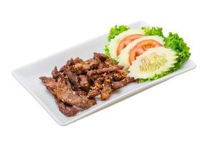 Fried pork thai style in a glass on white background photo