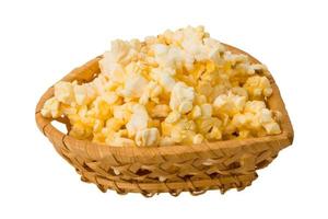Popcorn in a basket on white background photo