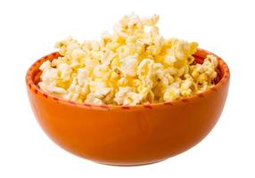 Popcorn in a bowl on white background photo