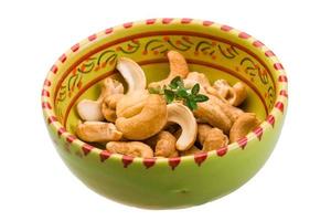 Cashew in a bowl on white background photo