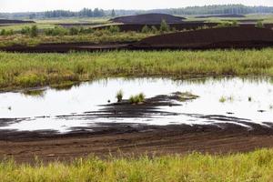 the flooded area where peat is extracted photo