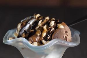 chocolate ice cream with peanuts, caramel and chocolate