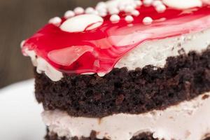 cake with cream and cherry berry jam photo