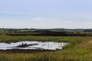 the flooded area where peat is extracted photo