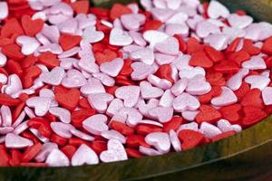 red and white sweet heart shaped candies photo