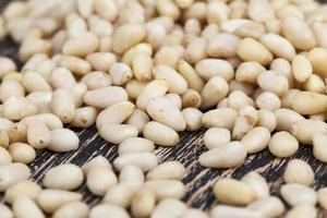 peeled pine nuts of small size photo