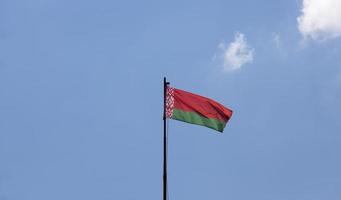 belarusian state flag on a blue sky photo