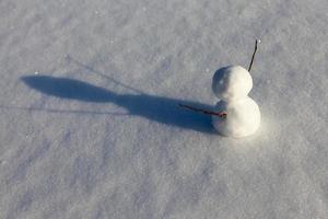 snowmen made of snow in winter photo