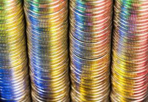 round shaped metal money stacked in a pile photo