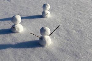 snowmen made of snow in winter photo