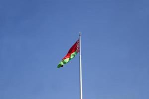 belarusian state flag on a blue sky photo