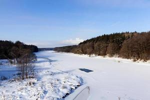 frozen water in the river photo