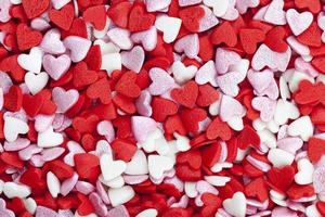 red and white sweet heart shaped candies photo