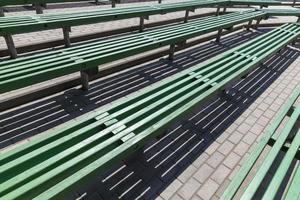 old wooden benches of green color photo