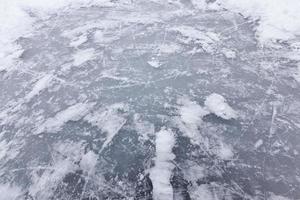 the surface of the lake frozen in ice photo