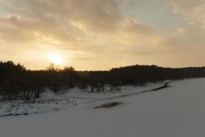 sunset with orange shades in the winter season photo