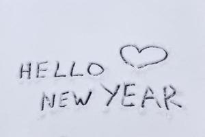 painted on the snow inscriptions associated with the coming of the new year photo