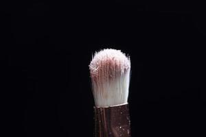 professional cosmetic brush with cosmetic product photo