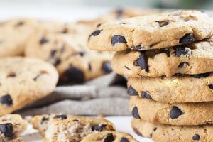 broken wheat flour cookies and large pieces of sweet chocolate photo
