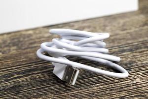 white electric wires and charger for mobile phone photo