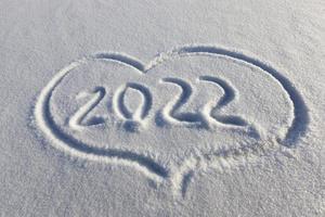 drawn in the winter season, the heart on the snow photo