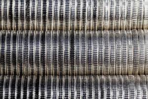 coins of silver color stacked together photo