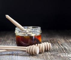 simple and self made ladle honey spoon is made of wood