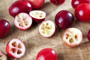 cut red cranberry berries divided into slices photo