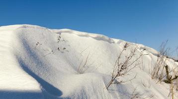 large snowdrifts after snowfalls and blizzards, the winter photo