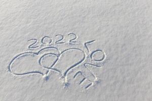 drawn in the winter season, the heart on the snow photo