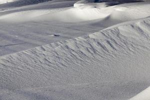 large snow drifts after a large number of cyclones photo