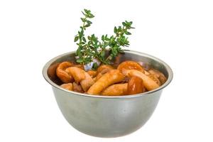 Armillaria in a bowl on white background photo