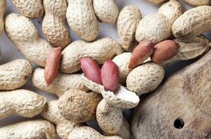 fresh roasted peanuts, delicious peanuts on the table photo
