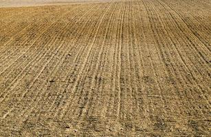 plowed fertile soil is an agricultural field photo