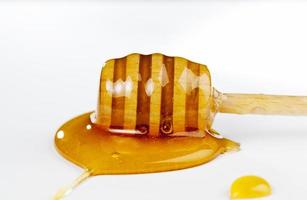 dipped in honey specially made from wood homemade coarse spoon photo