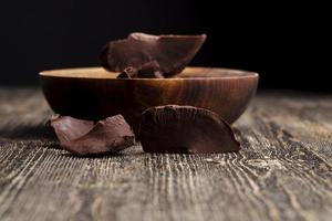 large chunks of chocolate with cocoa photo