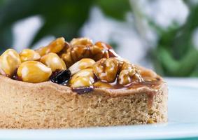 nut tartlets covered with a layer of sugar caramel photo
