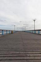a long pier on the territory of the sea photo