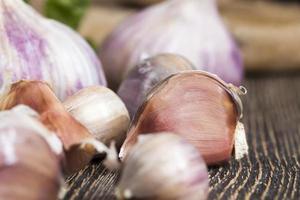 broken garlic and green Basil photo