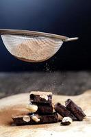 pieces of chocolate with hazelnuts photo