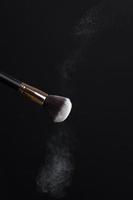 professional cosmetic brush with cosmetic product photo